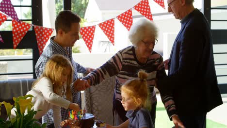 multi-generation family celebrating birthday in living room 4k