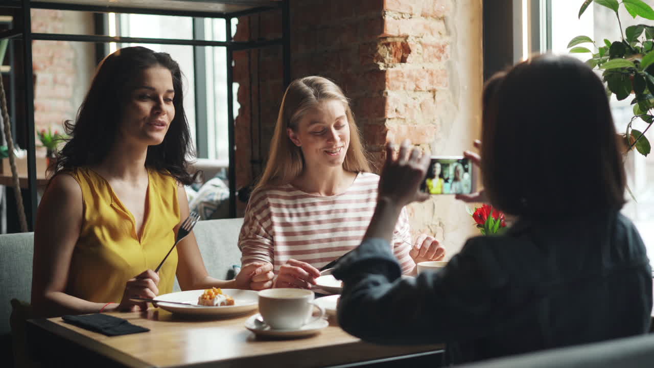 Women Friends Enjoying Lunch at a Cafe