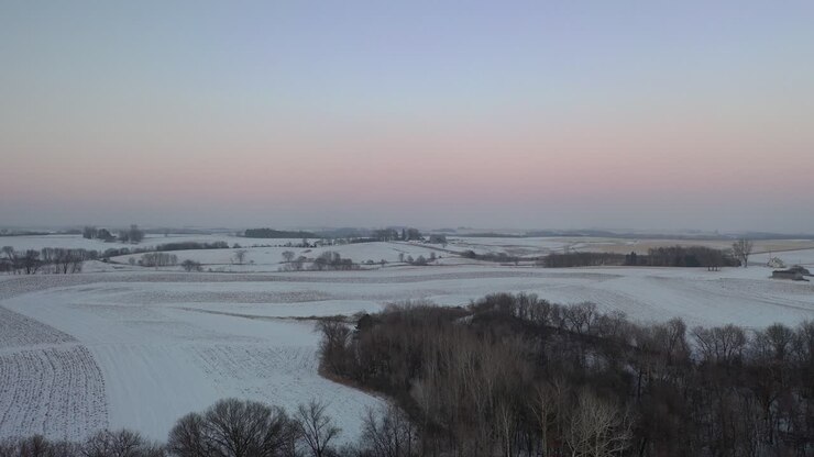 Winter Sunrise Over a Farmland Landscape