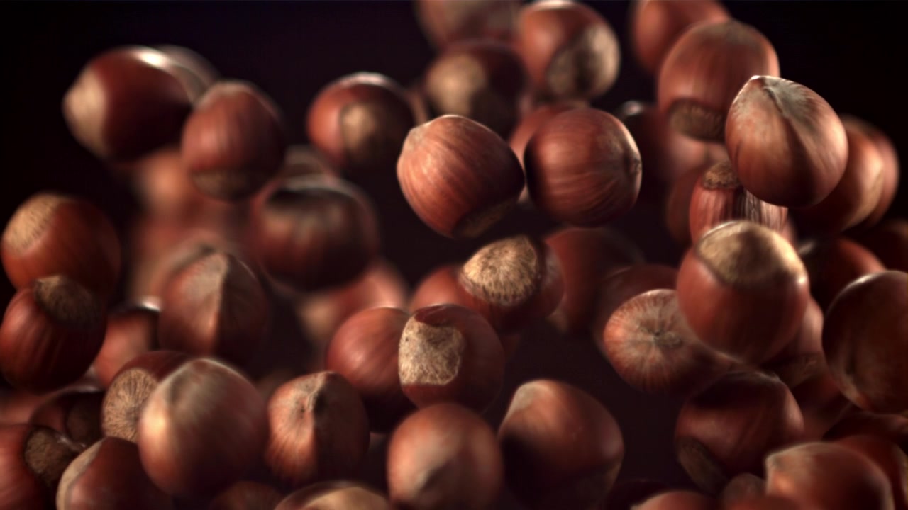 Nocciole che galleggiano e levitano in super slow motion