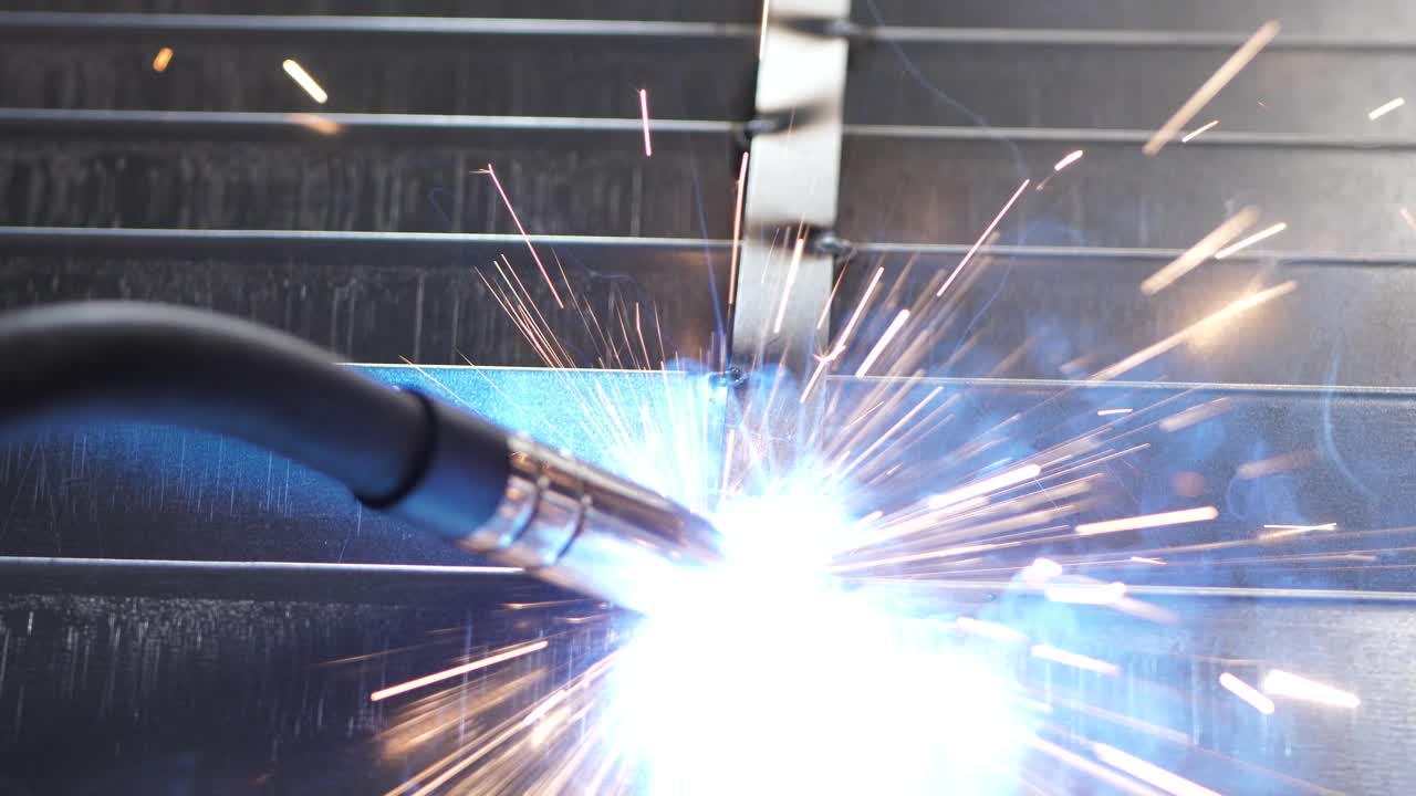 Close-up work with metal steel and iron using a welding machine