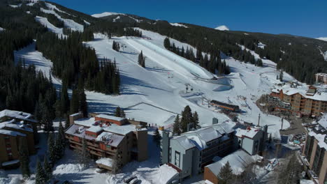 drone aerial copper mountain ski trails wintei snowboard resort half pipe training practice tricks competition colorado crisp cold early morning fresh snow lodging parking cinematic forward motion 4k