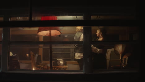 couple inside a vintage room at night