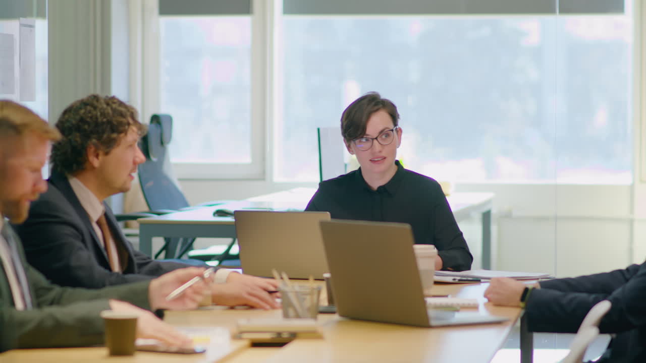 Businesswoman Holding Office Meeting
