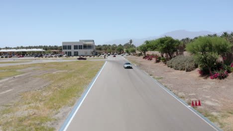 Drone-captures-video-of-multiple-cars-driving-on-the-streets-of-Palm-Spring-Valley,-California,-near-Los-Angeles,-USA