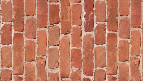 seamless looping motion. specially prepared for filling the background with a seamless brickwork pattern. antique brickwork of baked clay brick. vertically oriented video.