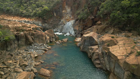 Low-flight-up-Yate-River-on-Grande-Terre,-New-Caledonia,-near-dam-of-Yate