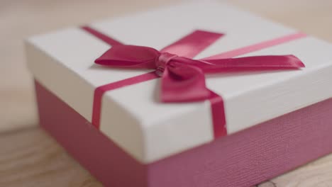 Close-Up-Of-Romantic-Valentines-Present-In-Gift-Wrapped-Box-On-Table-3