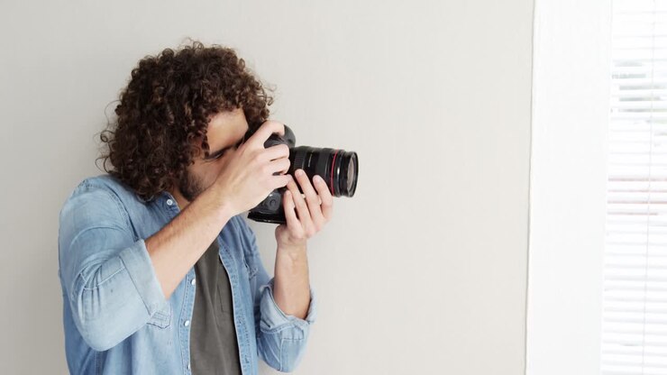 Photographer looking at photos on digital camera