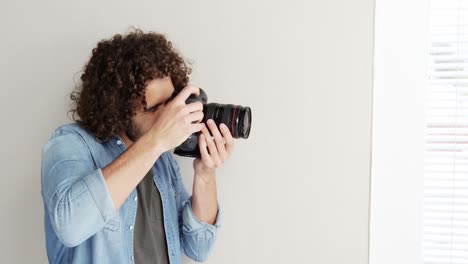 photographer looking at photos on digital camera