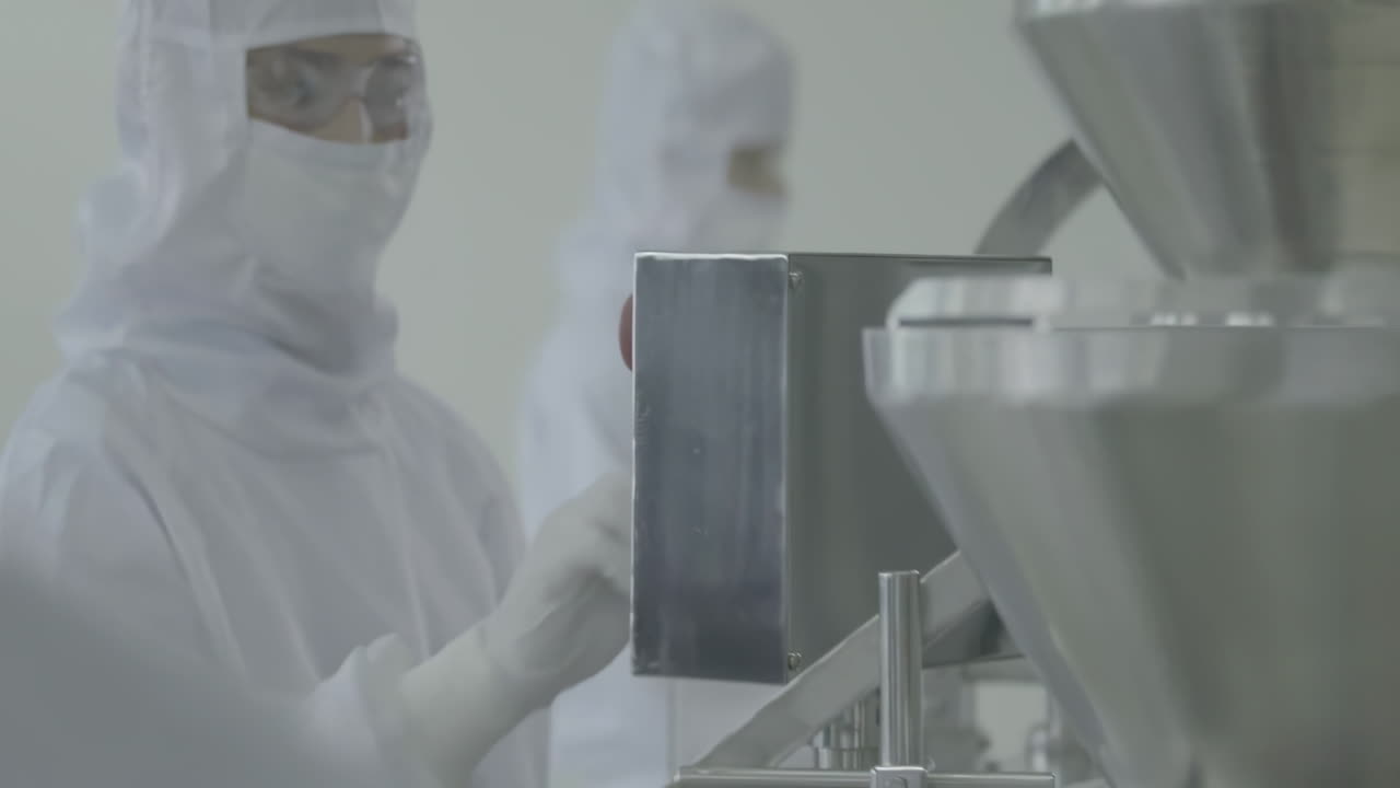 Lab workers in washing gloves on the blurred background of the production line. Scientist hand working in laboratory. science, chemistry and medicine concept. Pharmacist making medicines