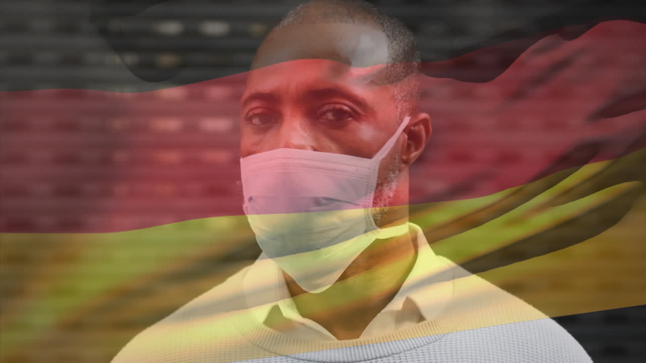 코로나 19 대유행 기간 동안 얼굴 마스크를 쓴 남자가 독일 국기를 흔들고 있는 애니메이션