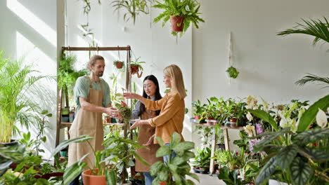 people shopping for plants in a plant shop