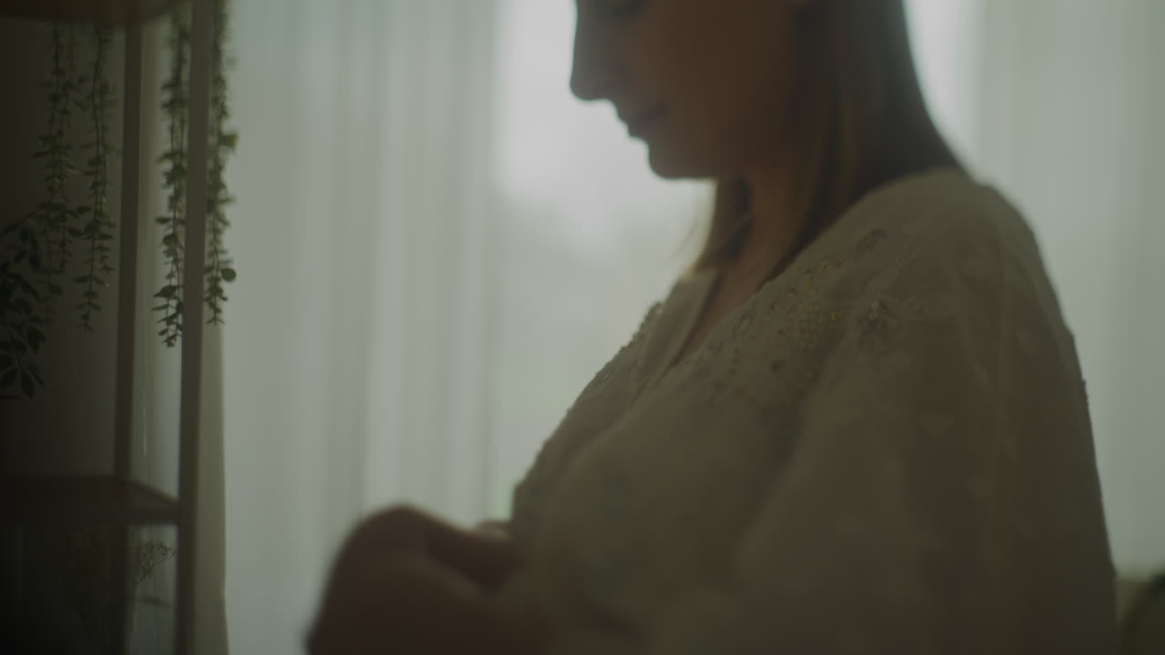 Pregnant Woman Gently Cradling Belly Close-Up