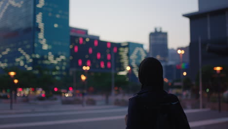 portrait of young muslim women excited enjoying viewing urban city skyline lights wearing headscarf