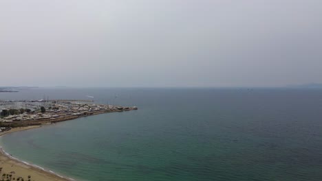 Marina-port-harbour-at-Aegean-Sea-in-Athens,-Greece,-aerial-coastline