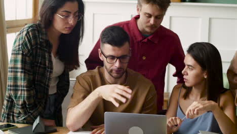 study group at a table standing and sitting at home 3