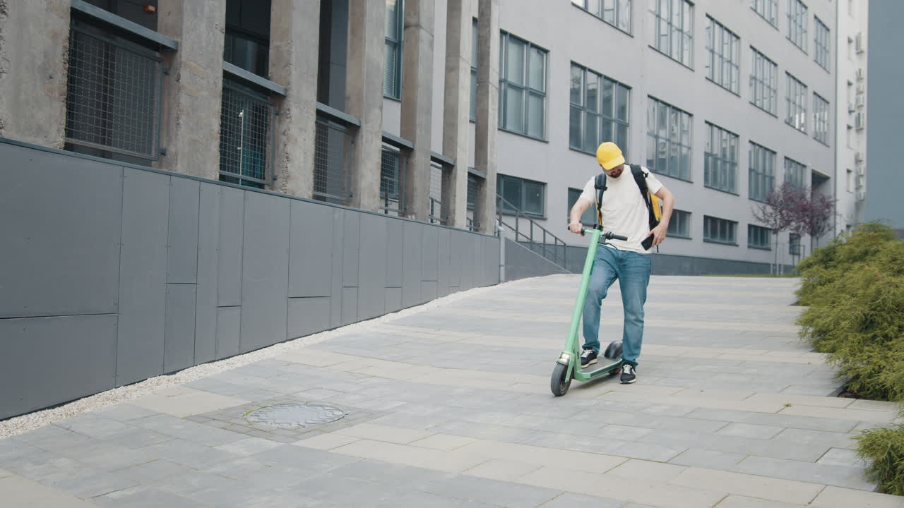 Delivery Person Riding an Electric Scooter in an Urban Setting