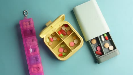 three different pill organizers