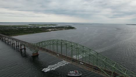 an aerial shot of the fire island inlet bridge on long island, ny