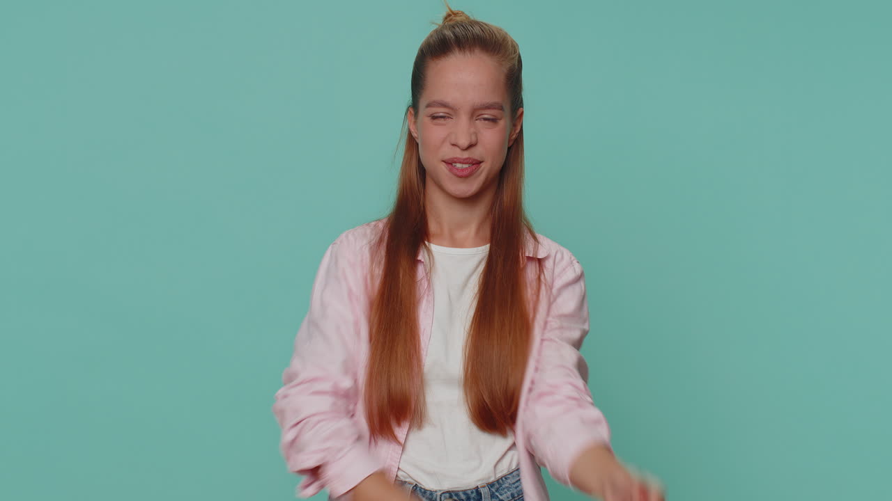 Upset girl showing thumbs down sign gesture, expressing discontent disapproval dissatisfied dislike