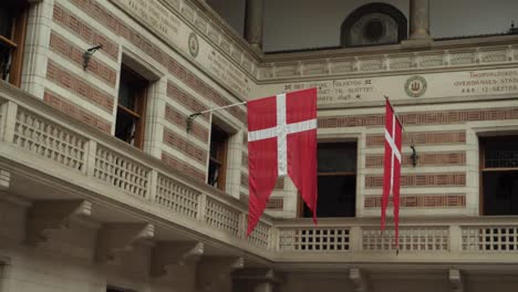 Danish-flag-in-Copenhagen-city-hall,-slow-motion