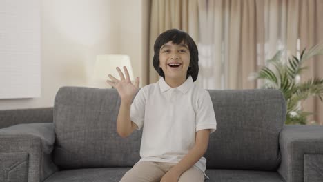 Happy-Indian-boy-saying-Hello-to-the-camera