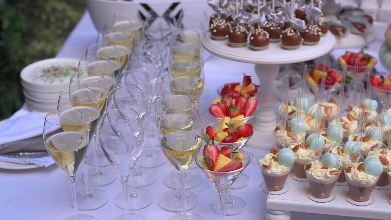 Cinematic close-up shot of dessert table on an event. Candy bar idea