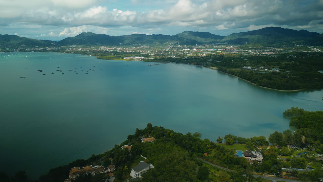 Aerial view of a tropical bay with a coastal city