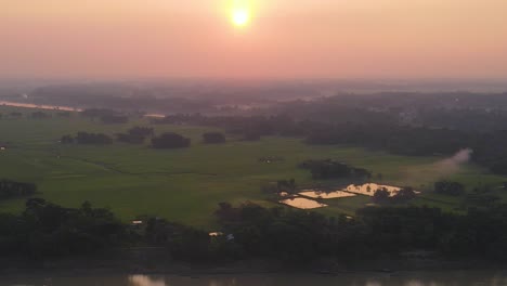 early morning landscape of river with boats in sylhet, bangladesh, aerial