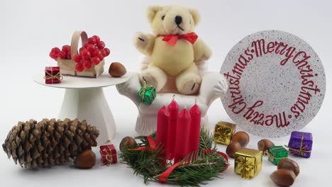 teddy bear and  christmas decorations, white background,
children's decorative composition