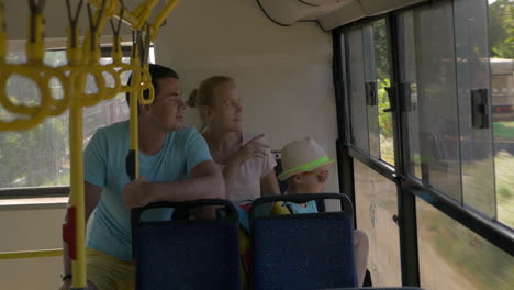 family traveling by bus in the countryside