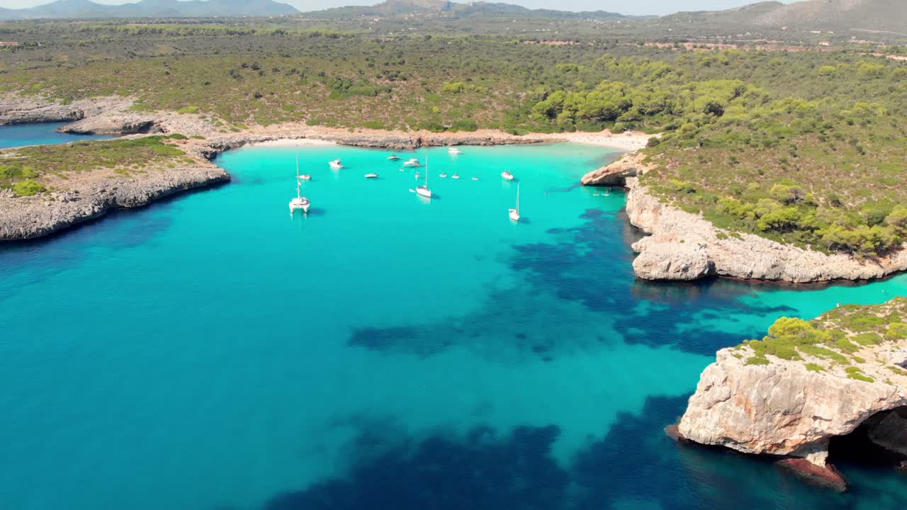 Aerial footage on Cala Varques beach, Mallorca. A hidden paradise with crystal clear water.