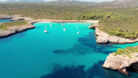 aerial footage on cala varques beach, mallorca. a hidden paradise with crystal clear water.