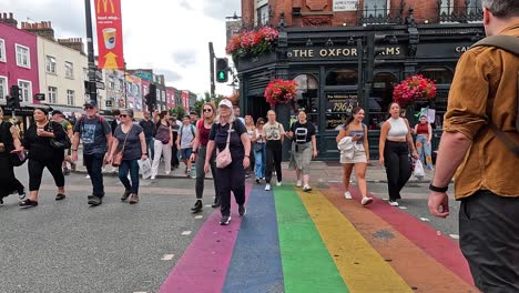 people crossing rainbow pedestrian crossing in camden town