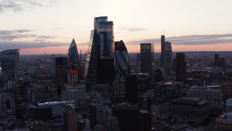 Elevated-view-of-modern-business-district-with-tall-skyscrapers.-Office-and-commercial-buildings-in-evening.-London,-UK