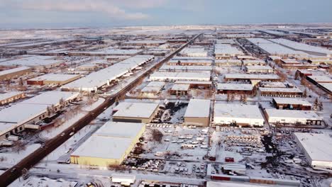 aerial view of a sunny winter day in a canadian industrial area covered with snow