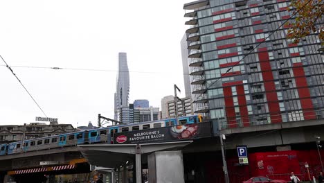 tram moves past buildings in melbourne, australia