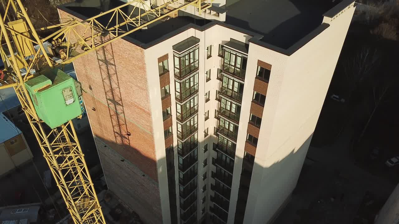 Construction site with tower crane. Construction site with working crane on sky and house district