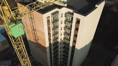construction site with tower crane. construction site with working crane on sky and house district