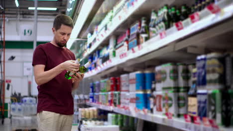 man shopping for beer in a grocery store