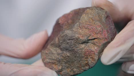 mineral sample in scientist's hands