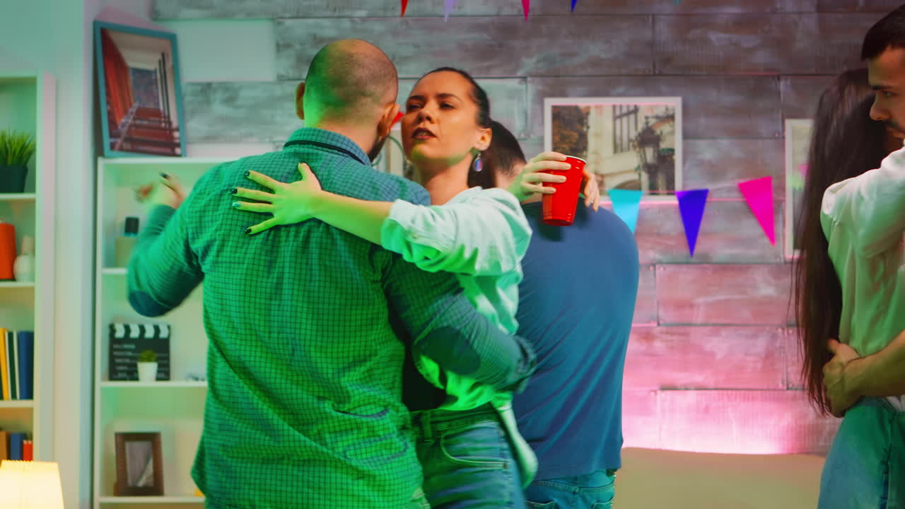 Young beautiful couples dancing on romantic music