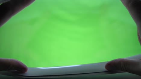 4k . hand open the jalousie. green screen
