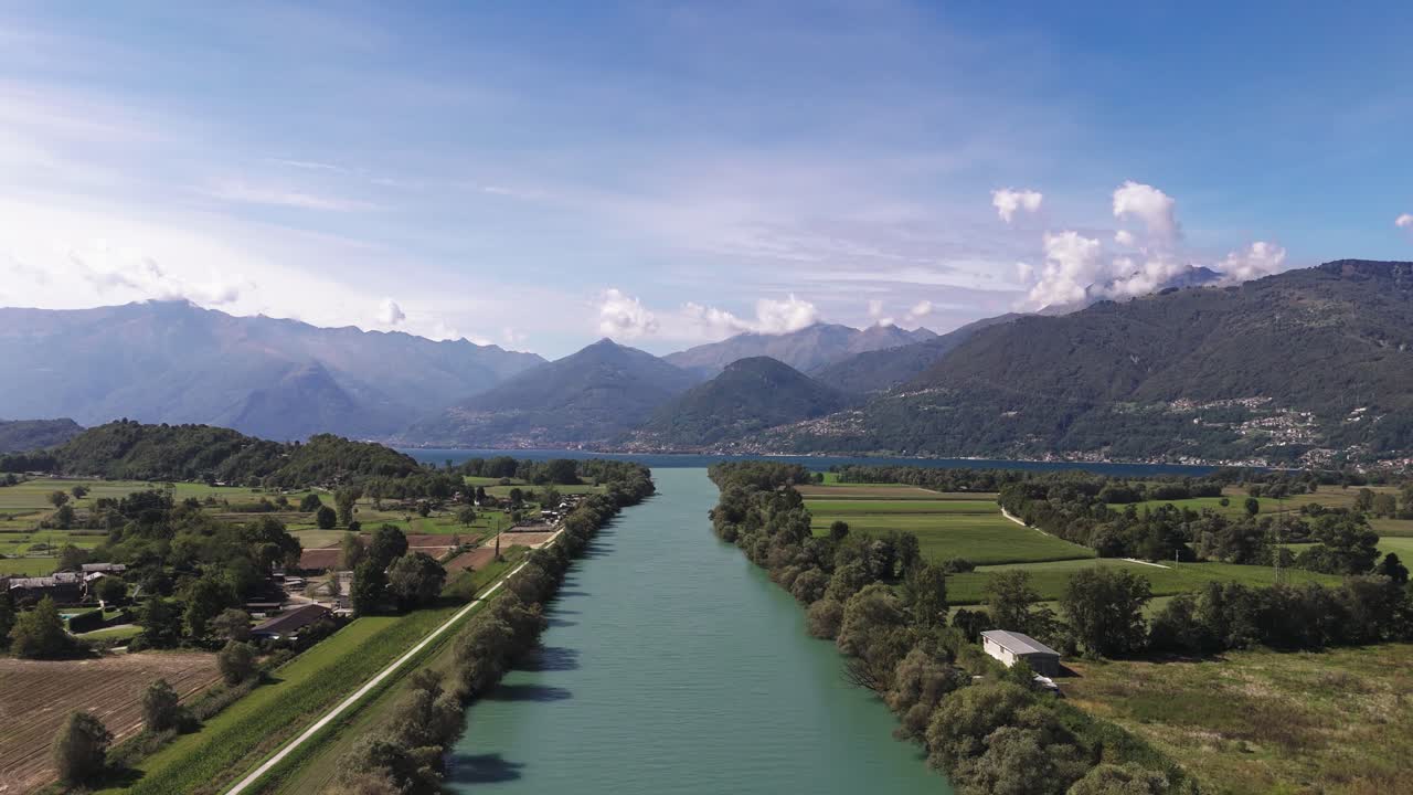 Fly forward, upwards, view of Adda river and Lake Como, Italy