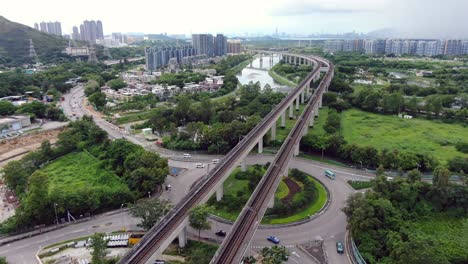 Hong-Kong-MTR-Railroad-in-the-city-outskirts,-Aerial-view