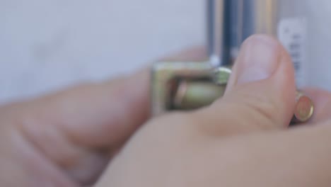 man turning a bolt on a coupler to repair a burst pipe