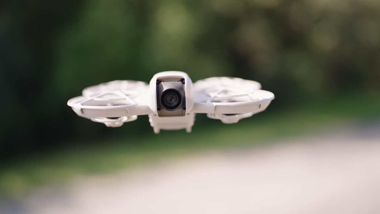 White Drone Flying Outdoors