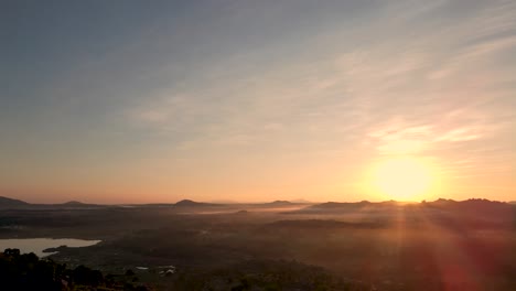 Picturesque-aerial-view-of-scenic-landscape-during-golden-sunset-at-horizon-in-India