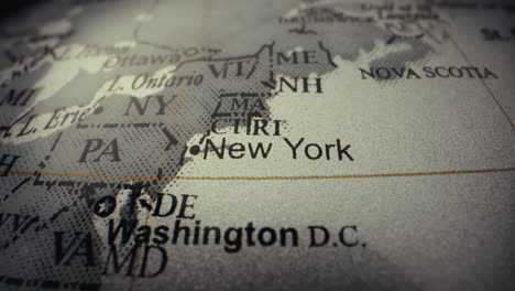 close-up of a world map, focusing on new york